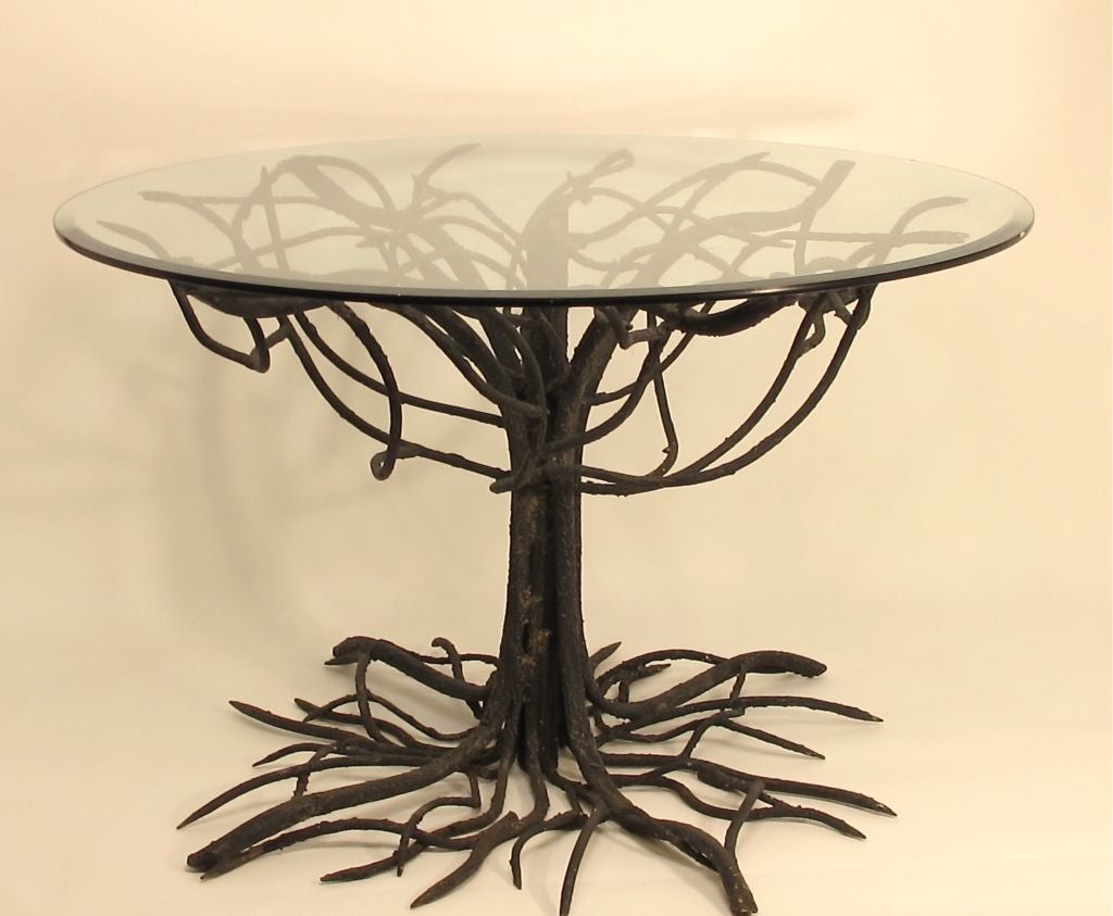 Completely hand wrought and painted iron table base with lots of patina and very realistic root system. We are selling the base only, the glass is not included. This would make an interesting center table or dining table.