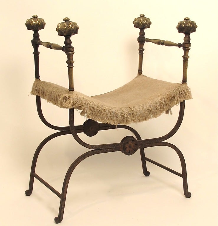 Exceptionally good looking wrought iron and bronze chair.