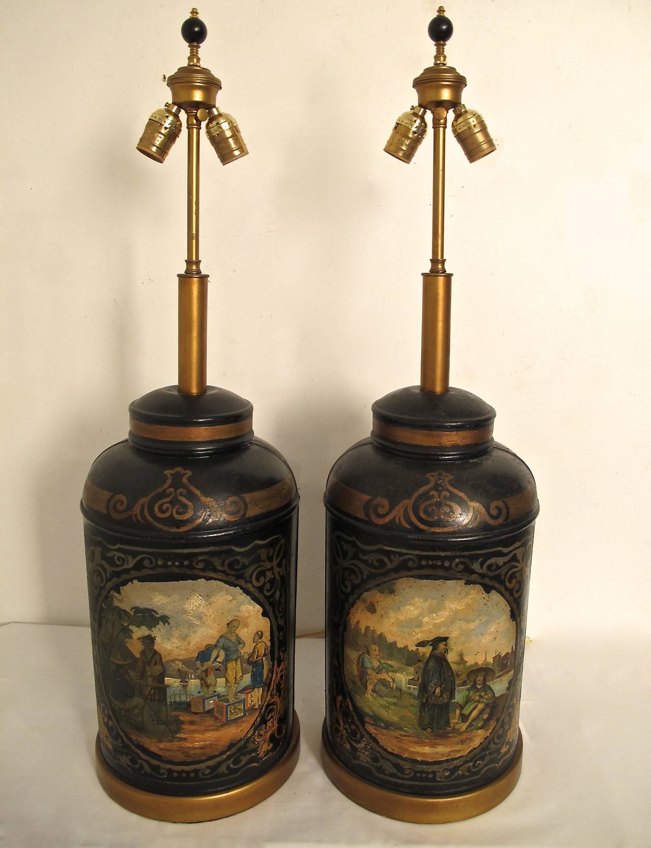 A pair of genuine tole painted tea canisters now converted to lamps. England, early to mid-19th century.