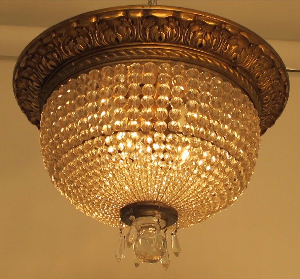 Exceptional quality, beaded and gilded cast bronze flush mount ceiling light.