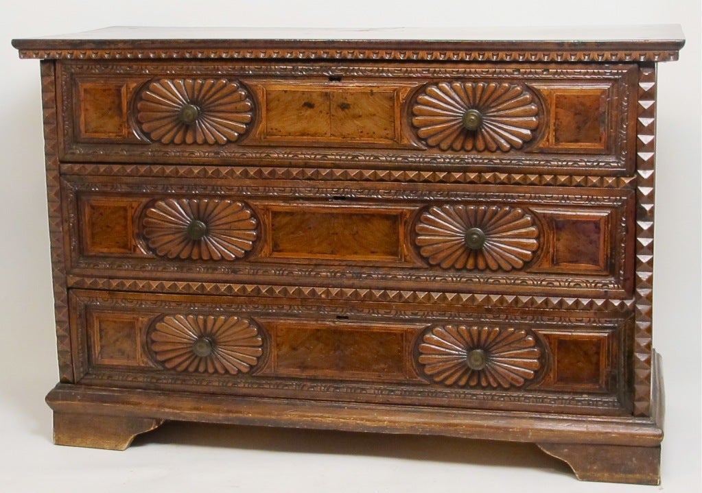 An excellent and unusual example of an early Italian 18th century (possibly late 17th century) solid walnut three-drawer chest. Beautifully hand-carved detail with burl walnut drawer fronts. Bold, handsome and impressive chest with a deep rich