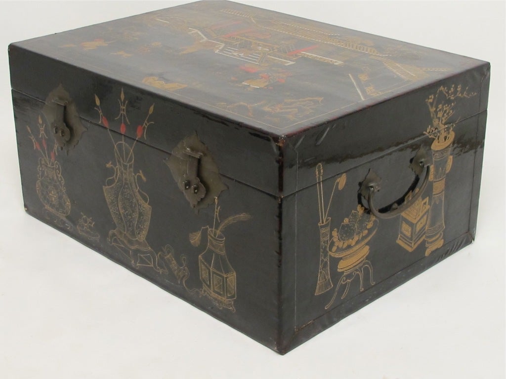 A Chinese black lacquered pigskin trunk with hand painted garden court design and brass hardware. Two available and priced separately.