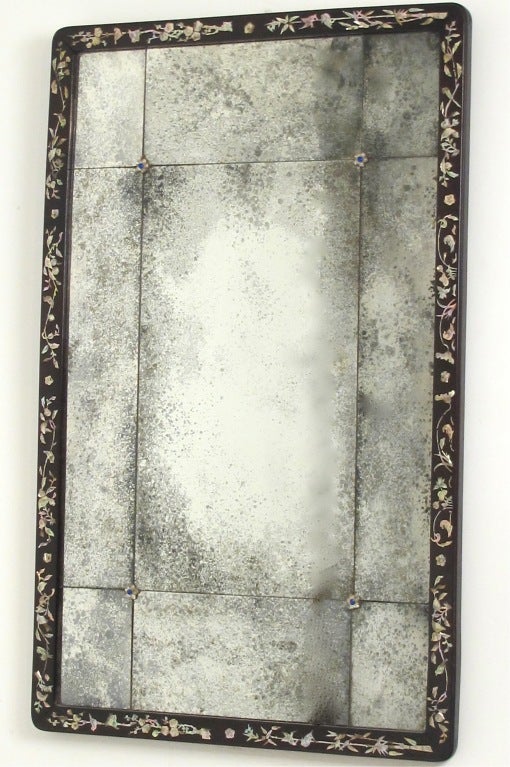 Antique Chinese frame inlaid with mother of pearl and aged mirror.