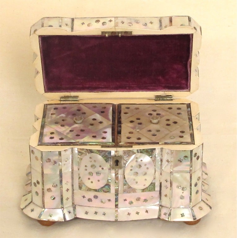 Extraordinary tea caddy with mother of pearl and inlaid abalone. Beautiful shape and detail in every way.
