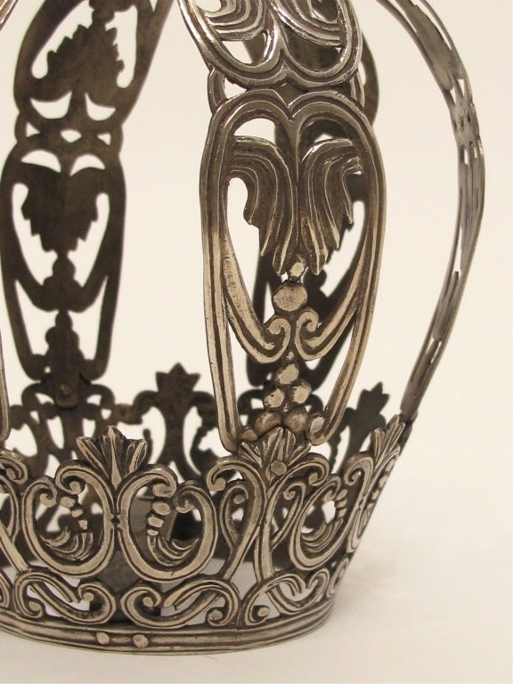 A large ornate silver santos or saint's crown. This crown does not have any marks but is a high grade solid silver.