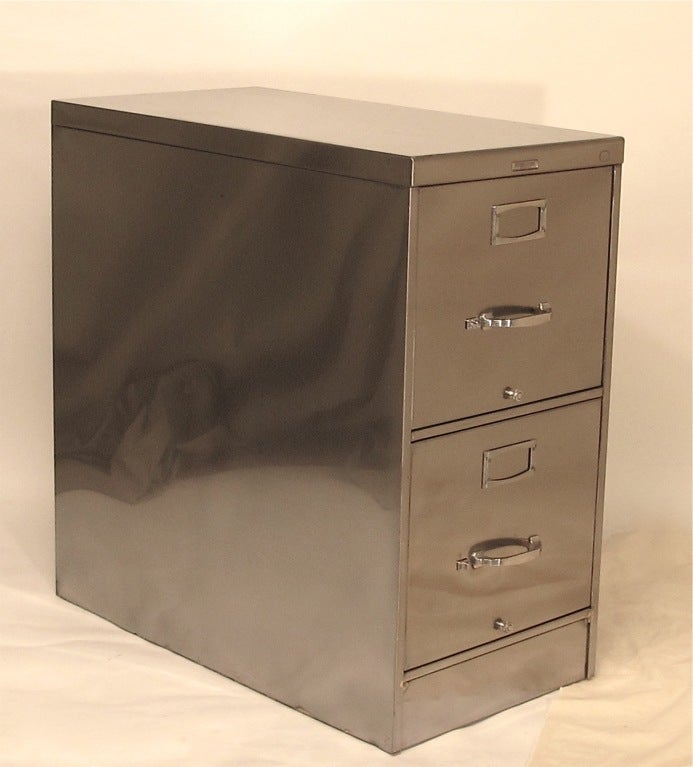 Polished Steel two drawer file cabinet by Steelcase.  Does not have lock and key.
