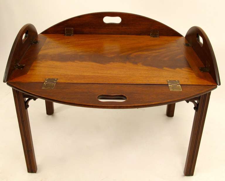 Mahogany tray with fold down sides on later custom made stand. Measurements below are with the sides up. 
England, early 20th century.