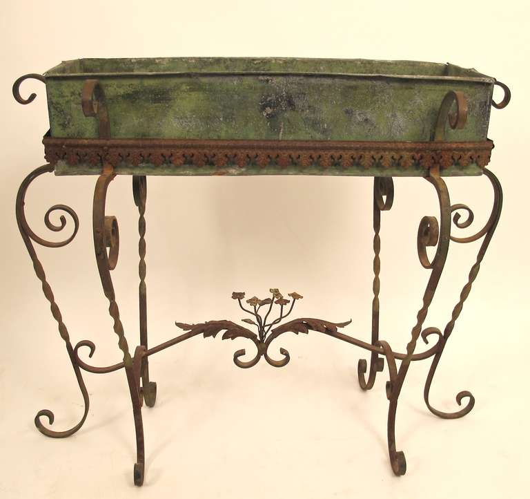 Wrought iron plant stand with original tin liner. Beautiful color, patina and charm.