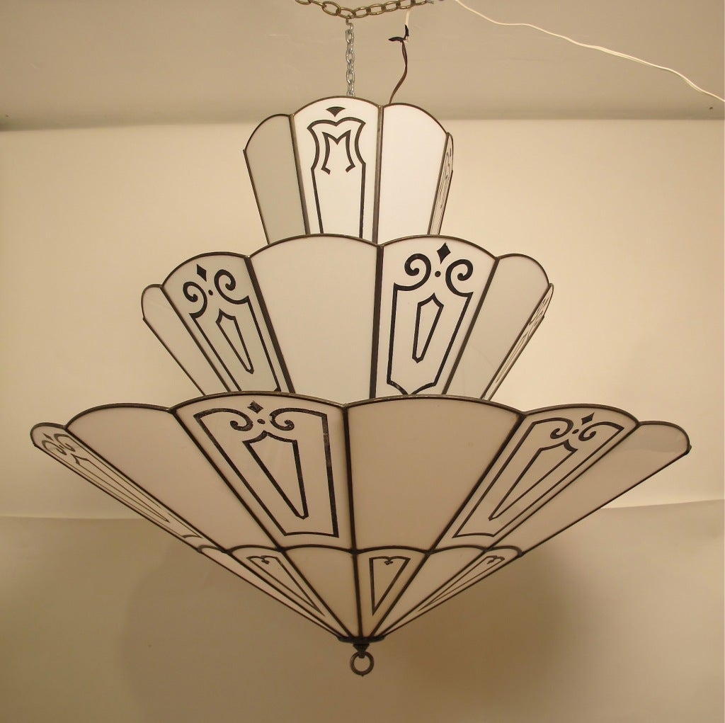 A very large Art Deco period ceiling light. Leaded opaque white glass with recessed and etched black design. The fixture holds 12 light bulbs.
This very light is shown in the book Extraordinary Interiors by Brian D. Coleman, pages 80/82.