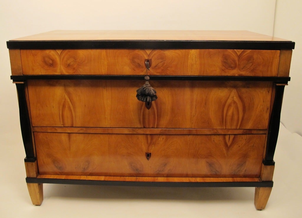 An early 19th century cherrywood three drawer chest with ebonized detail. Substancially constructed with generous size drawers.