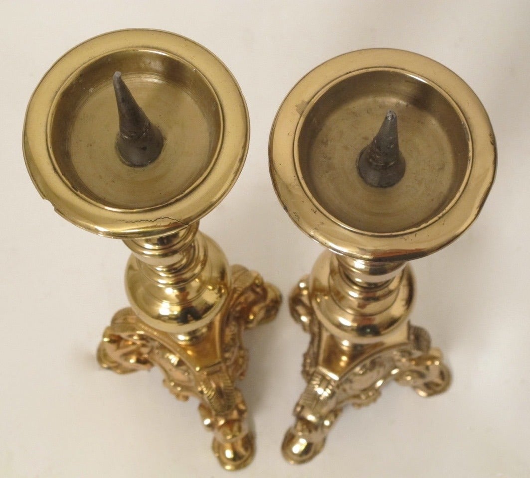 A large pair of late 18th/early 19th century brass candle prickets or candle holders.  Probably French (pre 1835).