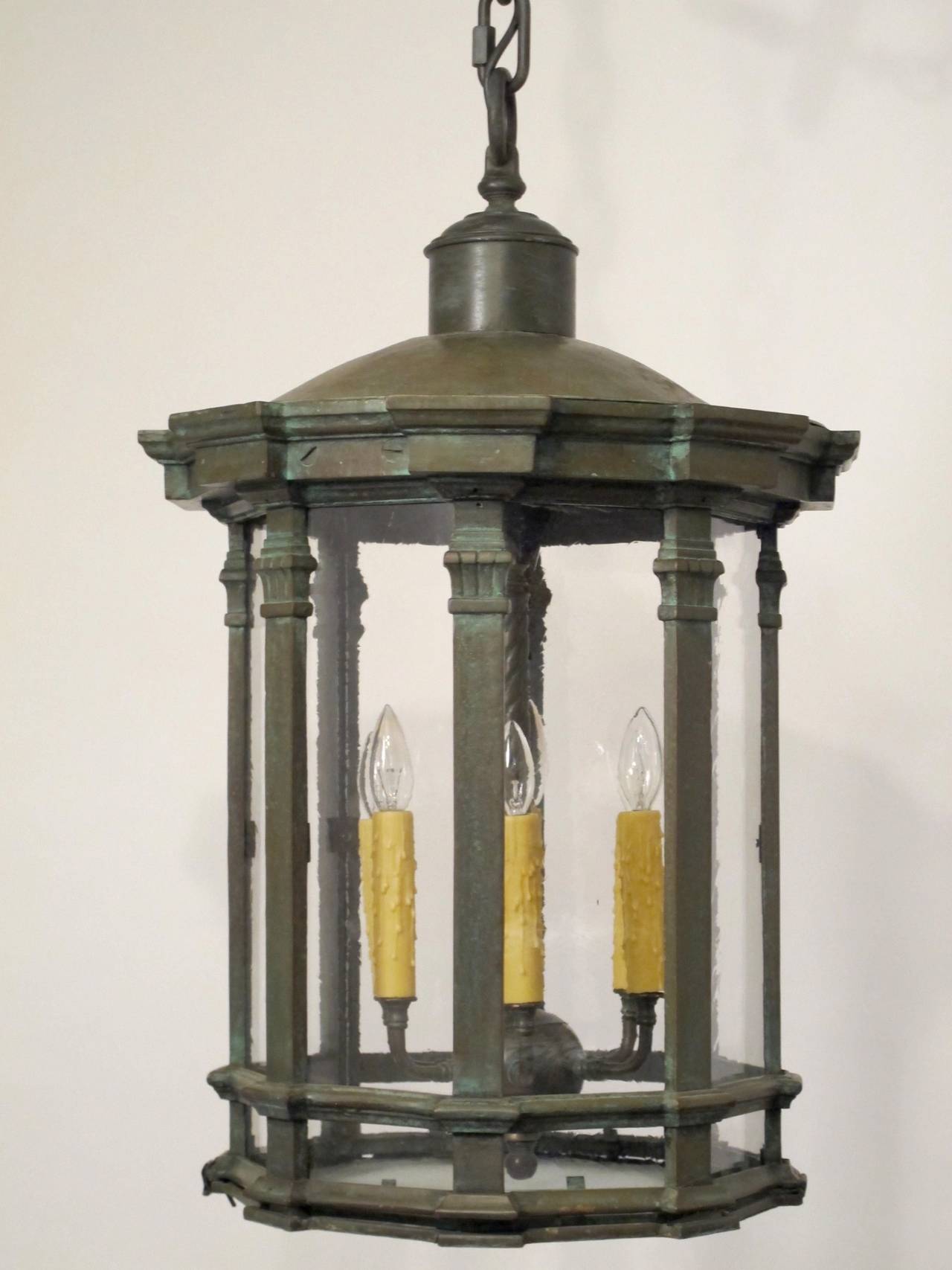 A bronzed cast iron and copper six-light lantern. Refurbished, re-wired and replaced glass panels. Large and very heavy, in beautiful condition. Comes with canopy and 30 inches of quality chain. We can provide longer chain if needed. We could also