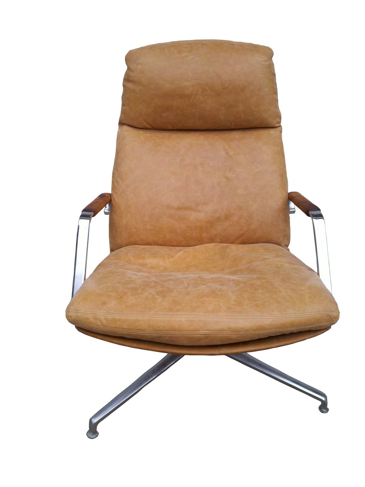 A very nice Danish modern swivel chair designed by Preben Fabricius & Jorgen Kastholm for Kill International, Denmark, 1968. Original leather back and arm banding, the down cushion has been expertly re-leathered with great care given to the original