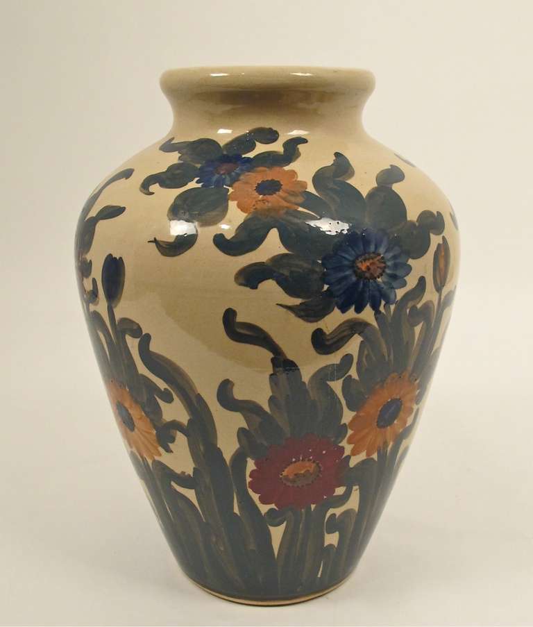 A very large hand-painted art pottery oil jar with floral decoration. American, early to mid-20th century.