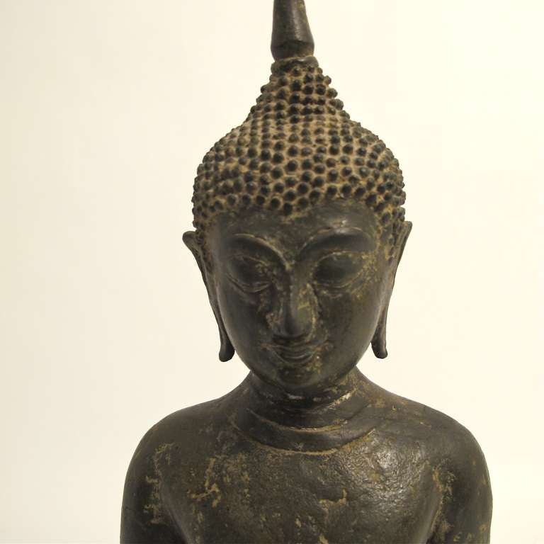 18th century (at the very latest) bronze buddha figure on custom made wood base. Height of statue without stand is 21.5 inches. We acquired this statue from a very fine San Francisco estate.