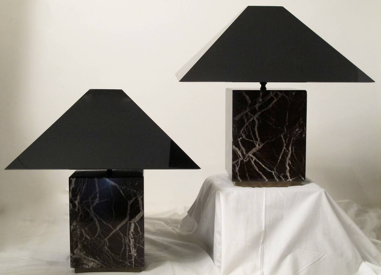 Pair of Burgundy Cube Marble Lamps with gray, white and black veining throughout sitting on bronze bases.  Black Lucite shades are included.  Italian, Circa 1970's.
Height of marble cube only is 12.5 high x 9 wide x 9 deep. 