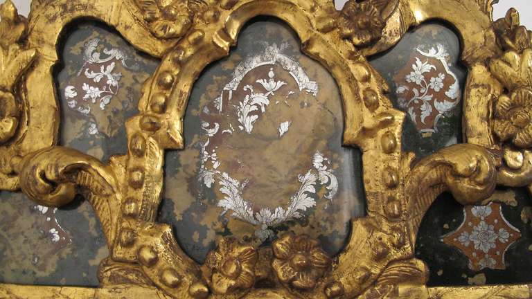 Carved 18th Century Eglomise and Giltwood Mirror