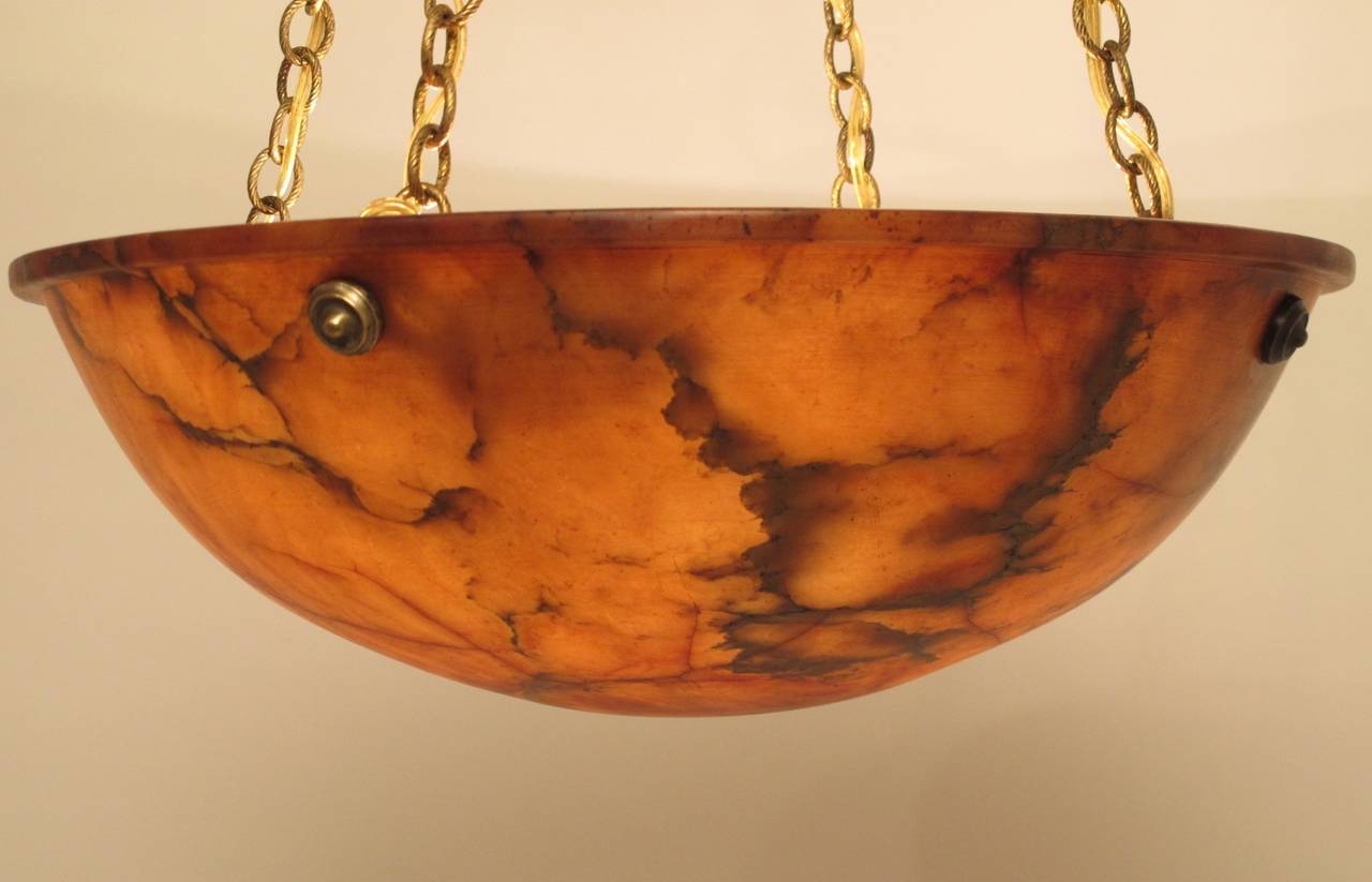 Amber color alabaster bowl with brass chain and canopy. Newly re-wired. 