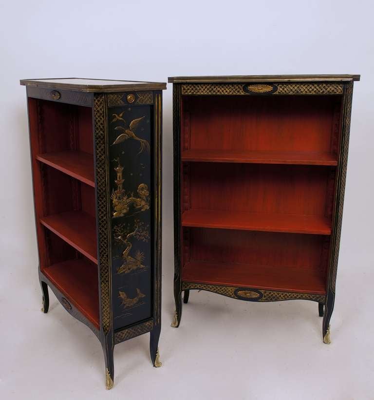 A pair of small bookcases with Chinoiserie decoration, gray marble tops and brass trim. Recently restored.
