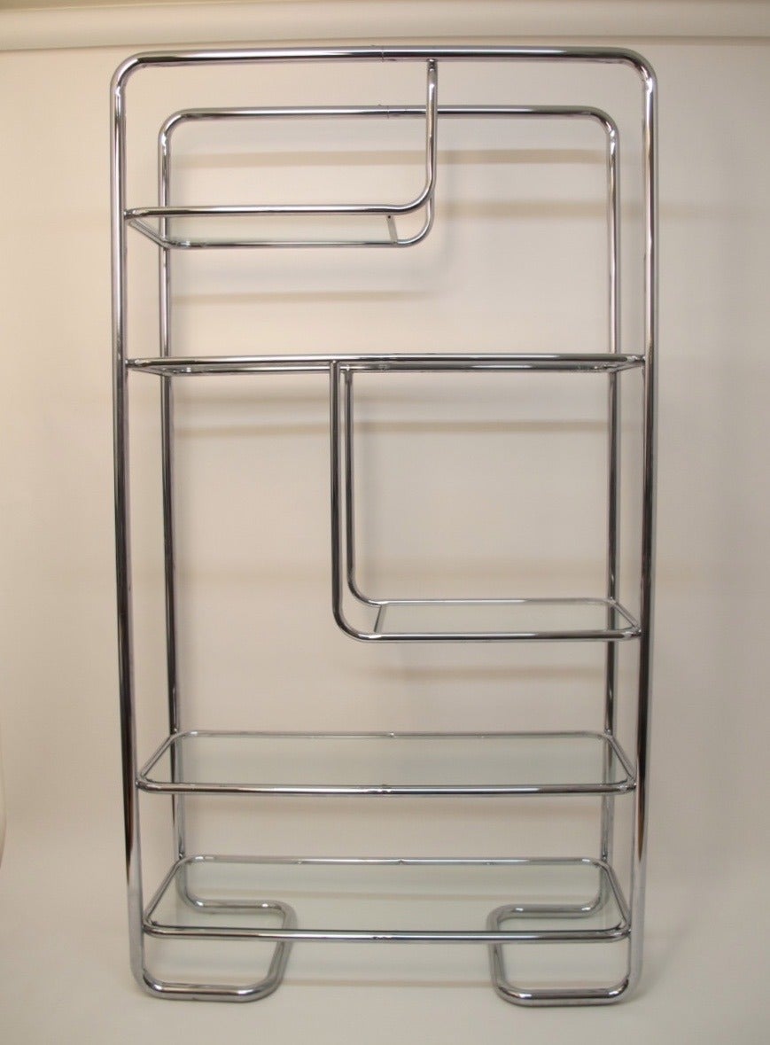 Mid 20th century tubular chrome and glass shelving unit or etagere. American, 1960's-1970's.