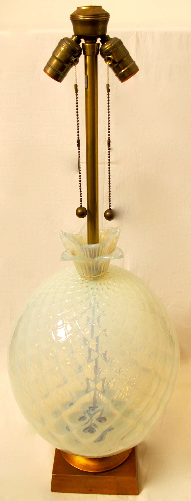 Large and exquisite opaline Murano glass lamp in a subtle pineapple shape. Retailed by Marbro, attributed to Seguso. Italy, mid 20th century.