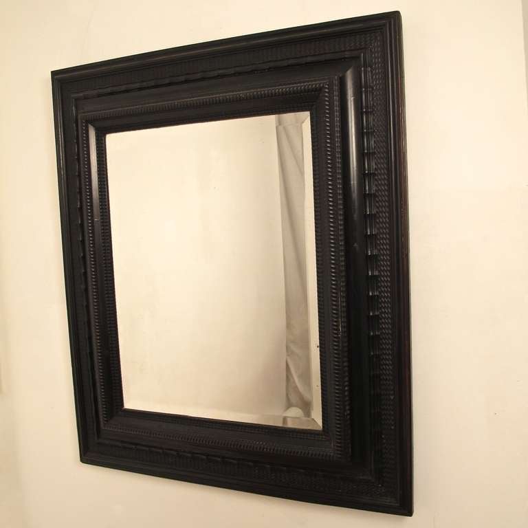 Beautifully made ebony frame with beveled mirror. 18th century Dutch/Flemish style, made in Italy in the 19th century.