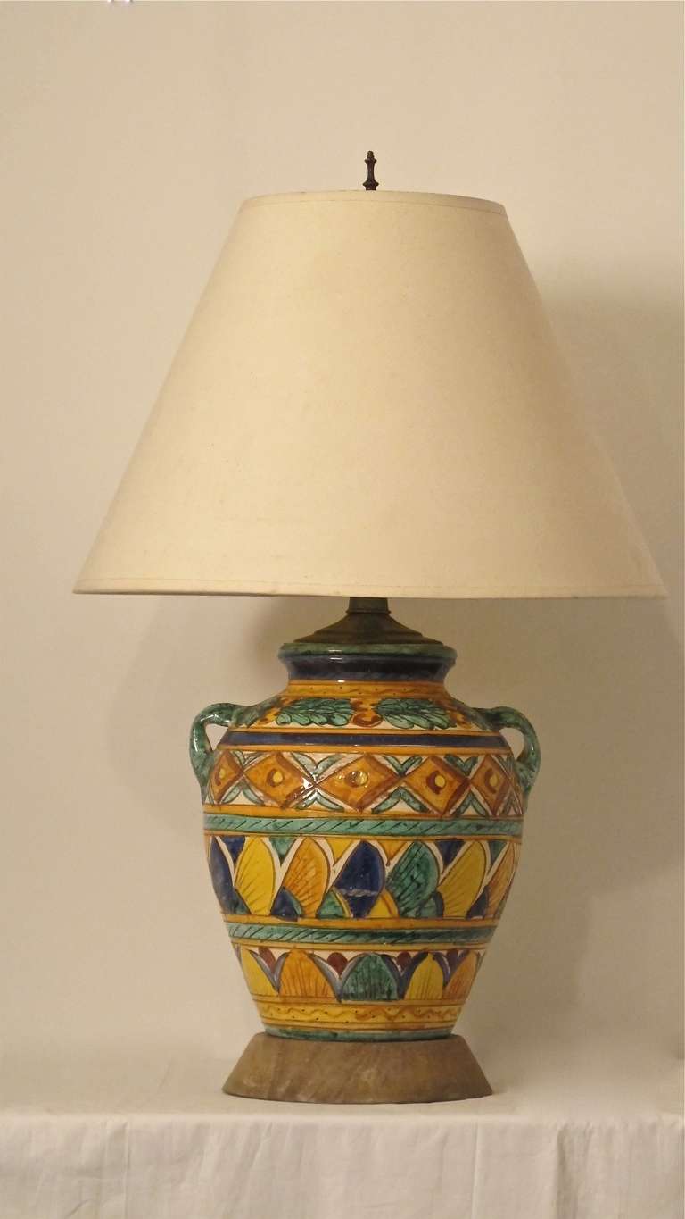 Italian or Mediterranean style pottery converted to a lamp. Newly rewired, shade not included.