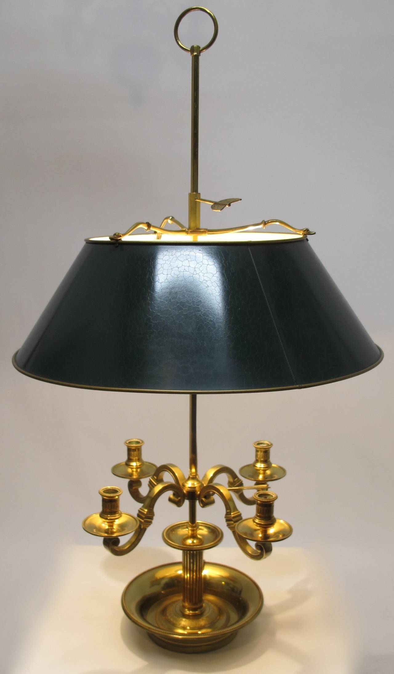 Brass Louis XV Style Bouillotte Lamp with four scrolling arm candle holders and green tole shade with crackle finish.  Rewired with two standard base sockets and online switch as well as pull chain for each socket.  French, first half of the 20th