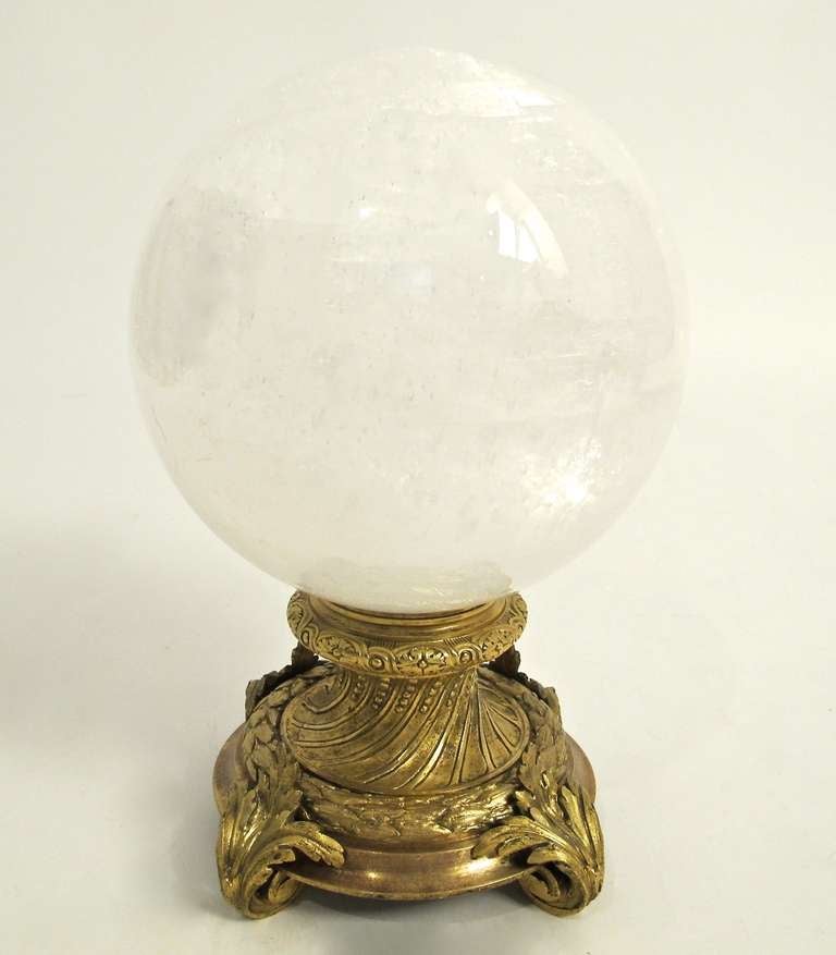 A very large rock crystal ball on an 18th century gilt bronze stand.
