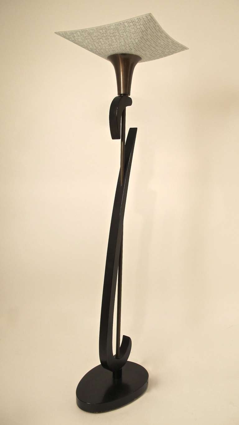 High Style 1950's Black lacquered floor lamp very sculptural with it's original square glass shade standing on ovoid platform base.  Recently rewired with 3-way standard base socket.  American, Mid-20th-Century.
