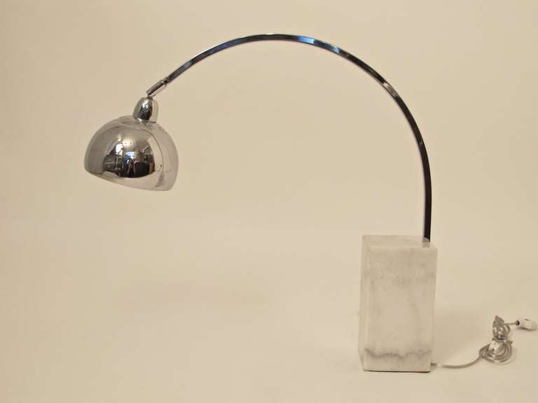 Iconic Italian mid century modern arc shape lamp. White marble base with chrome shade. Recently rewired to US standards.