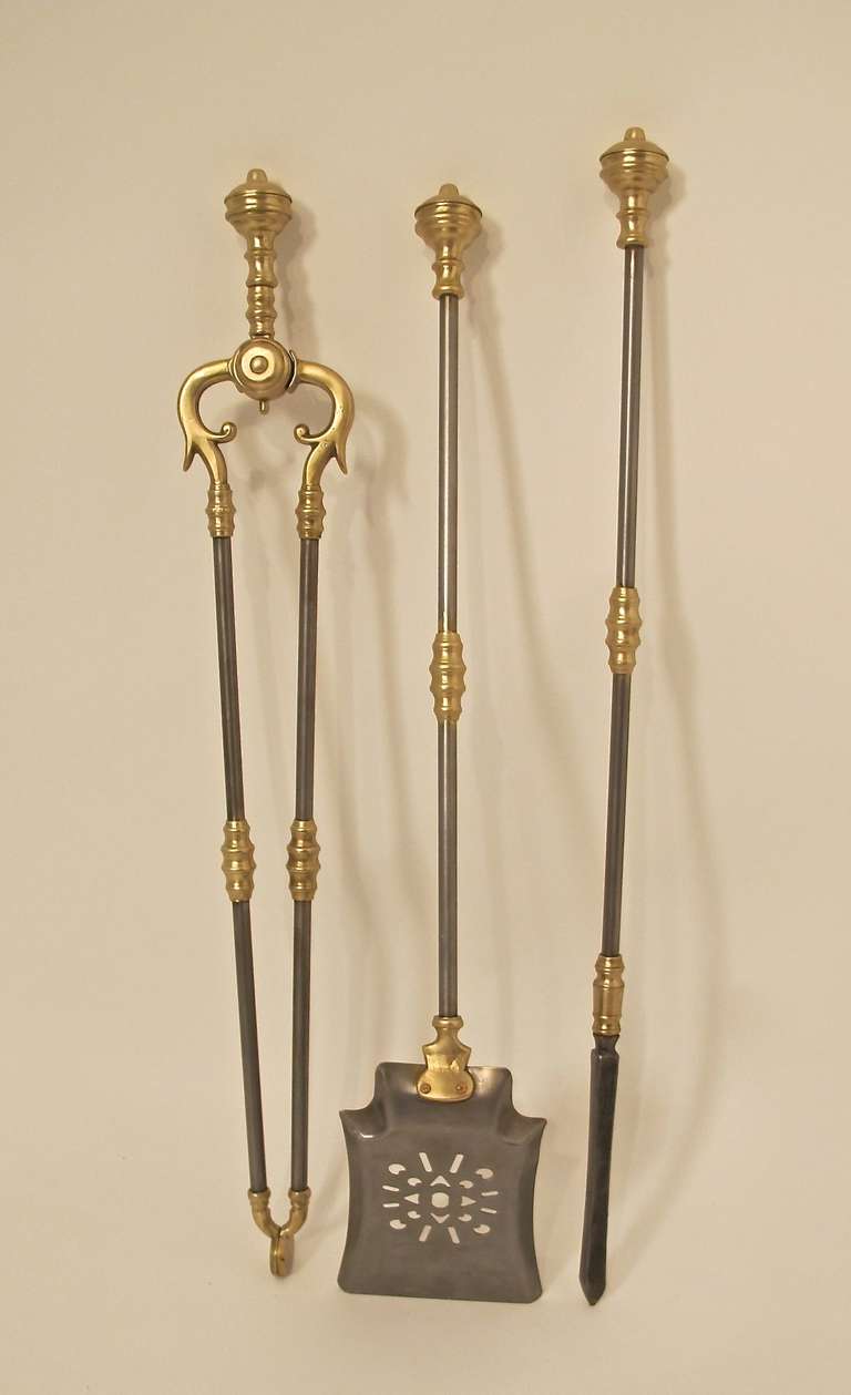 A set of English early 19th century steel and brass fire tools.