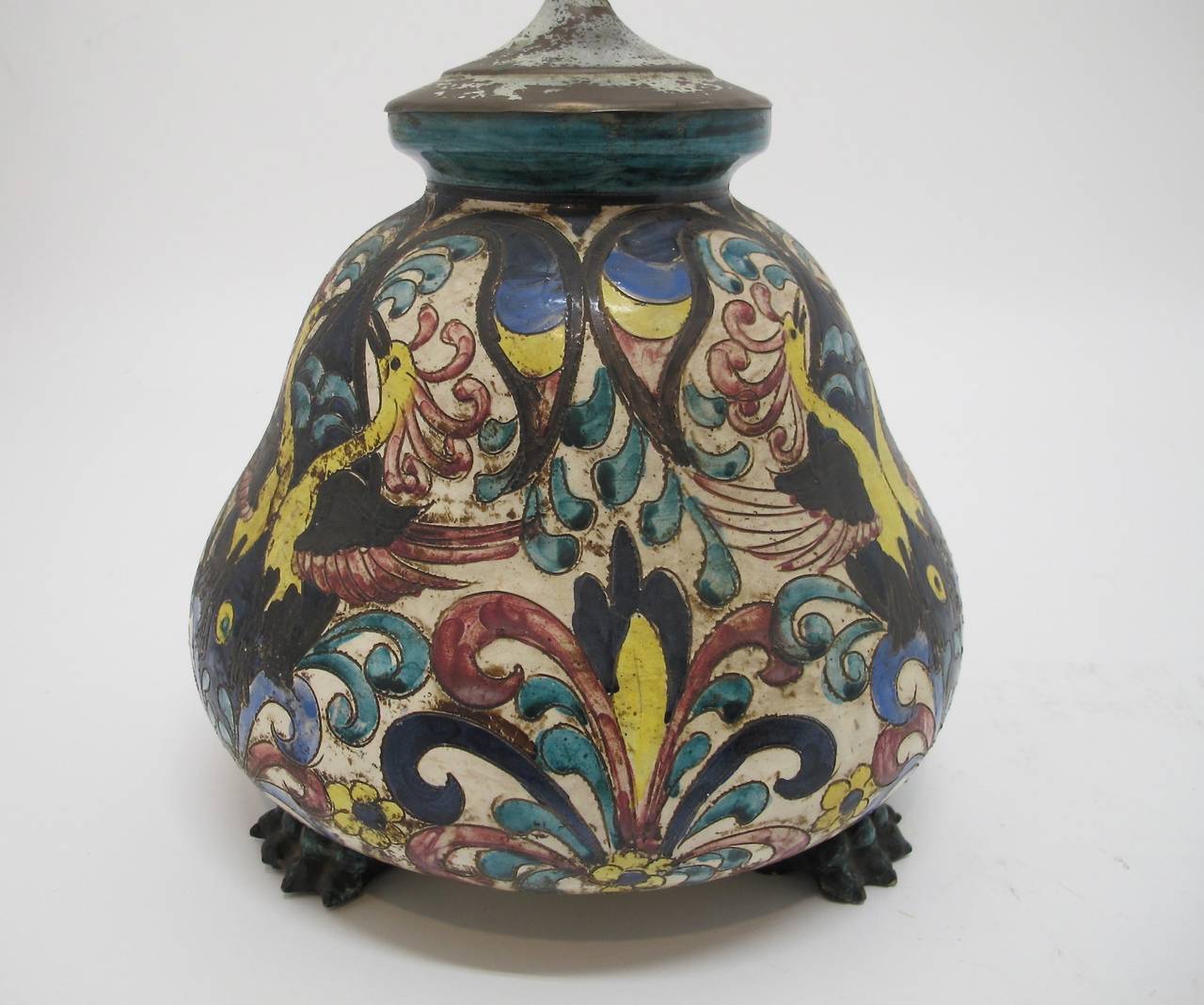 Wonderful bulbous shaped pottery lamp with hand painted design and paw feet. Italy, 1920's.