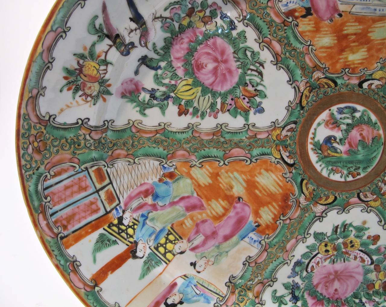 Large hand painted Famille Rose Medallion platter with beautifully detailed design of roses, people, butterflies and birds. Mid 19th century, China.