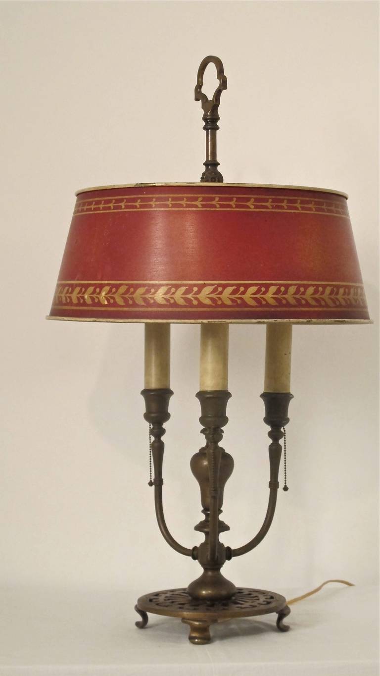 Bouillotte style brass desk lamp with original red tole shade. Newly re-wired. American, early 20th century.