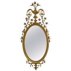 Miroir de style Adams sculpté et orné de feuilles florales