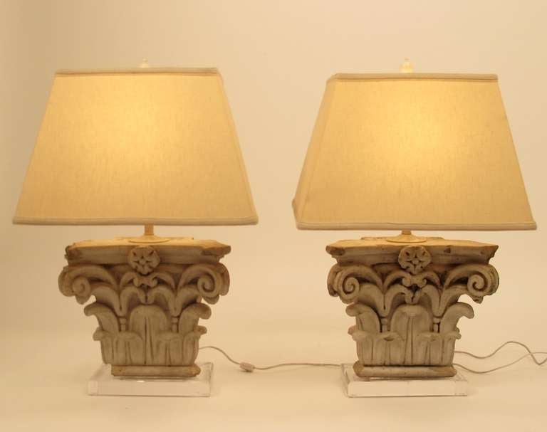 Terra-cotta half corinthian capitals mounted on acrylic bases. 1920's (most likely Gladding McBean). Newly re-wired. Measurements below do not include shades (shades not included).
