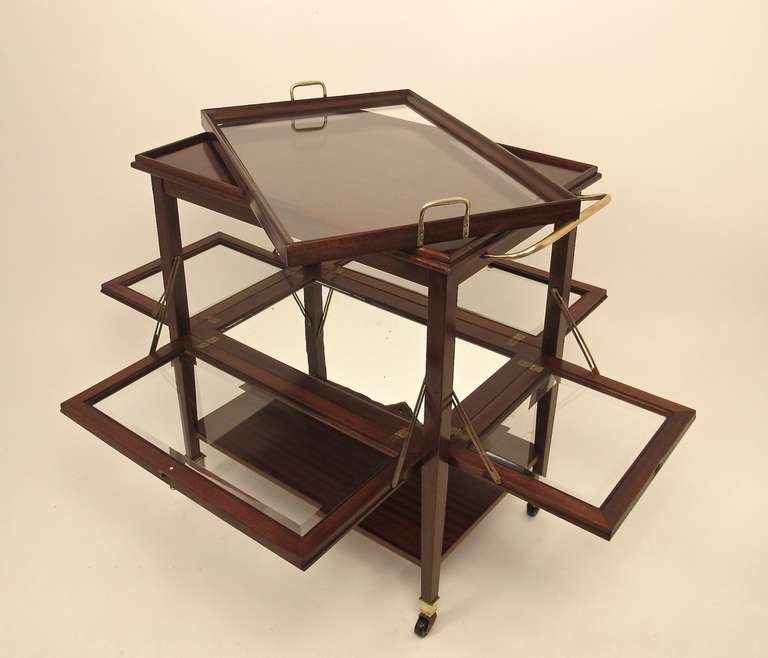 Mahogany cart with brass hardware, beveled glass, and removable serving tray.