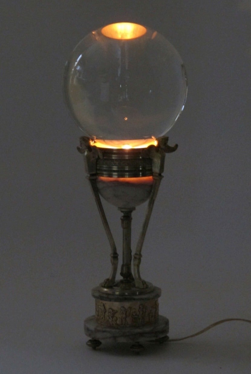 Glass sphere on a antique brass and marble base. Recently electrified. France, mid 19th century.
