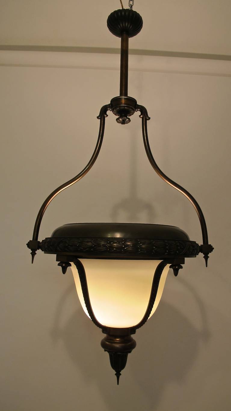 A late 19th century bronze and glass gas light now converted to electric. Beautiful original patina. Newly re-wired. American, circa 1885.