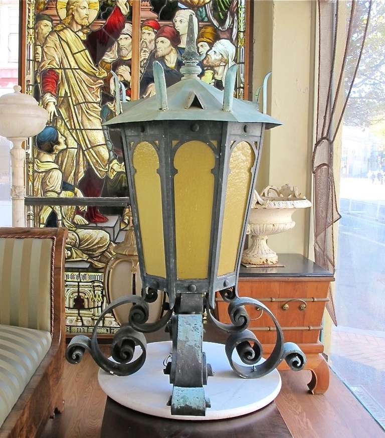 Spectacular and huge antique lantern with beautiful patina. Bronze and copper with amber glass panels. Newly re-wired. American, circa 1900.