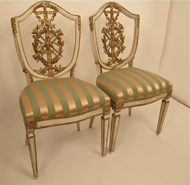 A pair of beautifully hand carved, painted and gilt side chairs. Having original paint and horse hair batting.
Recently upholstered.
Italy, early to mid-19th century.
