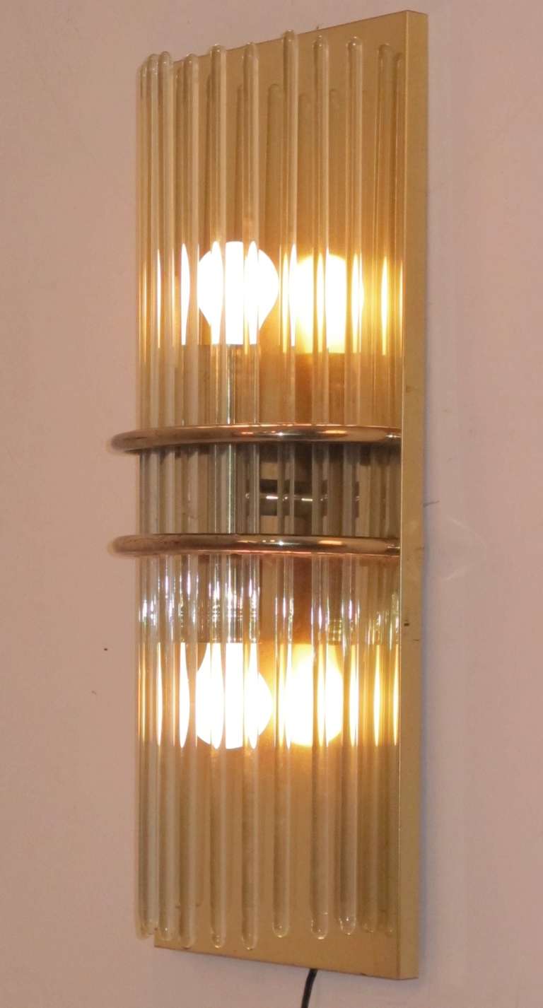 A pair of 1960s American brass and glass wall sconces, originally found in a resort hotel in Carmel, Ca. 
There are two pairs available. Price provided is per pair.
Re-wired and ready to install.