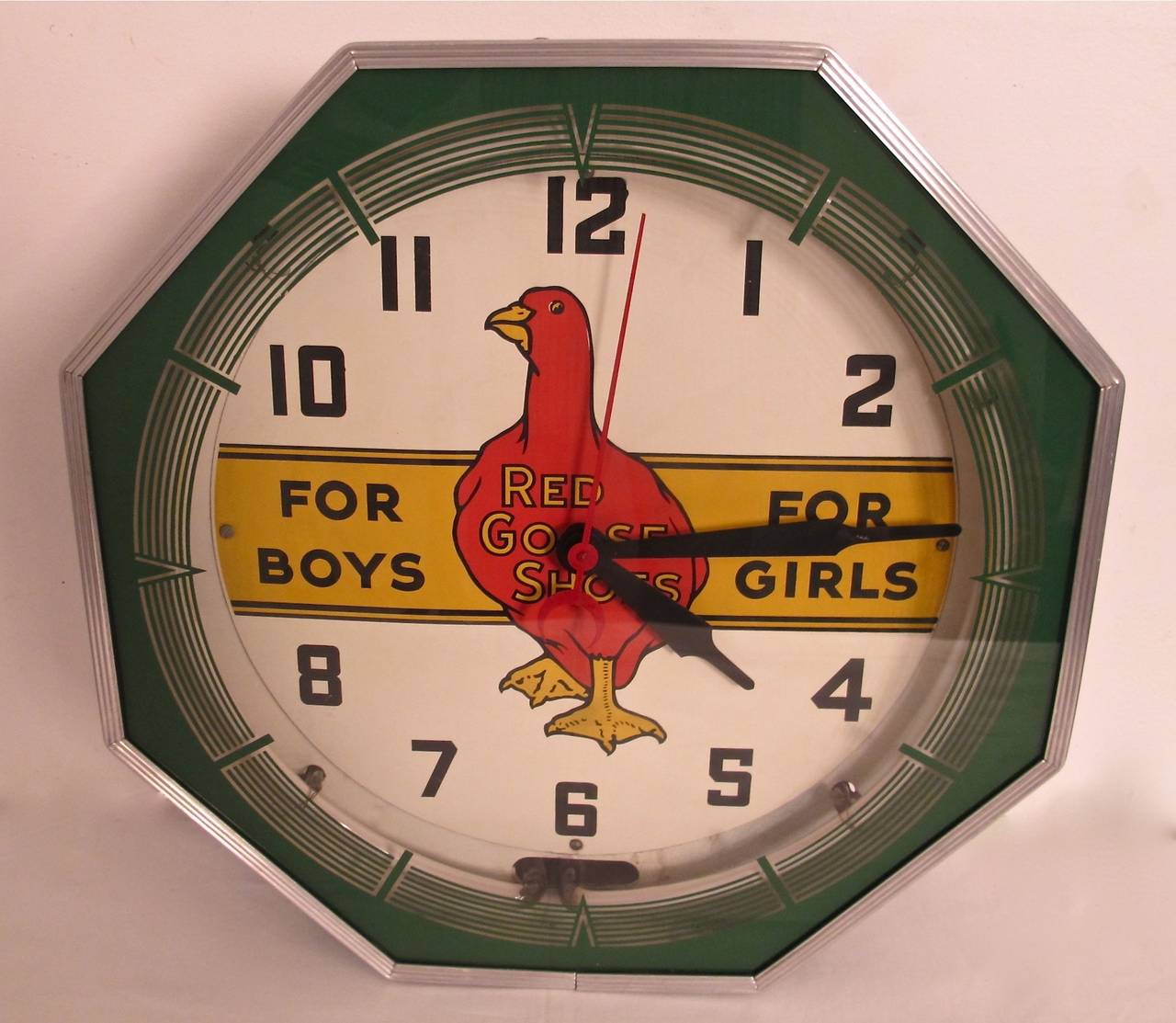Vintage advertising clock for Red Goose Shoes. Chrome frame with reverse painted glass front. Reconditioned and in working order, keeps accurate time.
