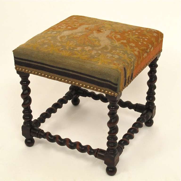 Barley twist stool with antique needlepoint seat and nailhead trim, England, late 19th century.