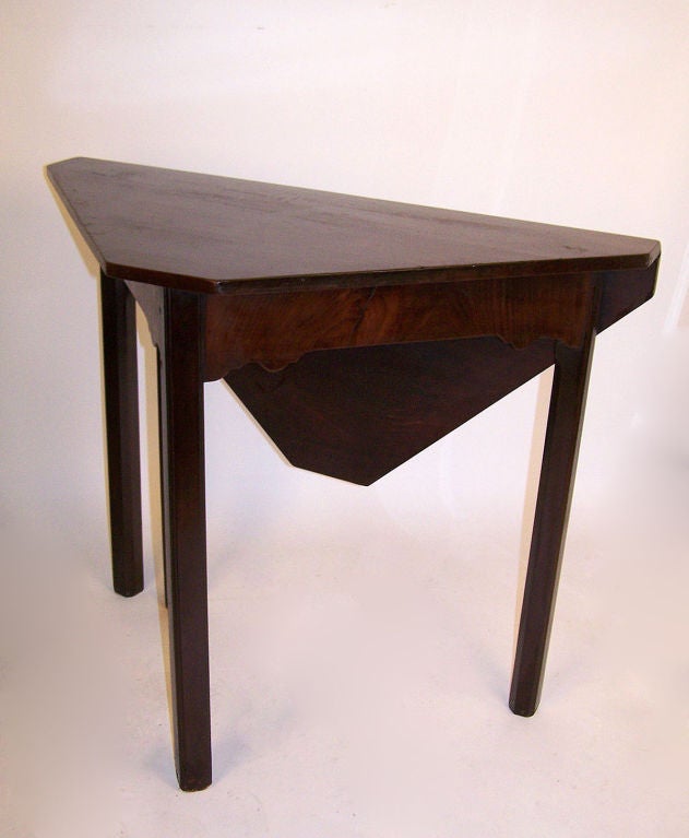 Mahogany table with single drop leaf and gate leg. Base has original finish and the top has a very old if not original finish. England, late 18th to early 19th century.