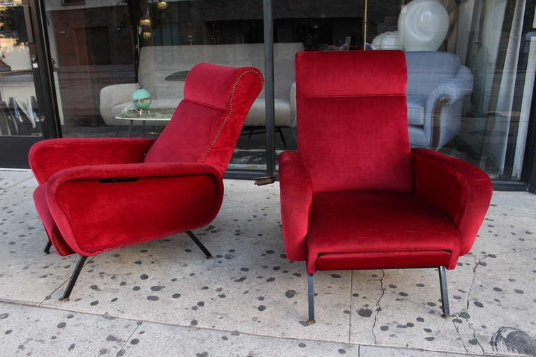 Italian pair of chairs in red  velveteen  original upholstery .
 Chairs are 1950s recliners with the built in ashtray