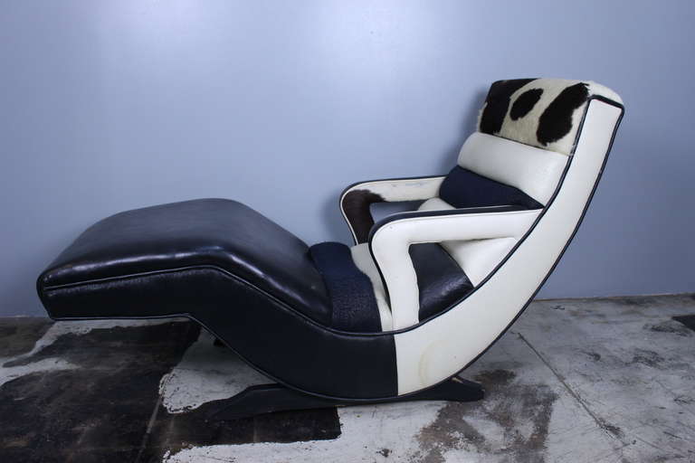 1950s chaise longue, mix of leather, sky and pony hair upholstery.