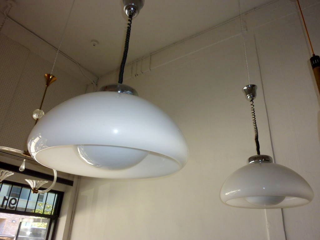 Artemide style light pendants. Adjustable height, opaline white shades (larger shade is acrylic and the bowl is glass) total drop extend to 45 in.