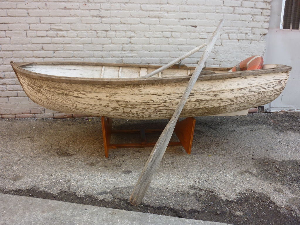 Wooden boat with all the gear. Fishing pol 3 ,rows 4, anchor and safety tube.Fantastic patina.